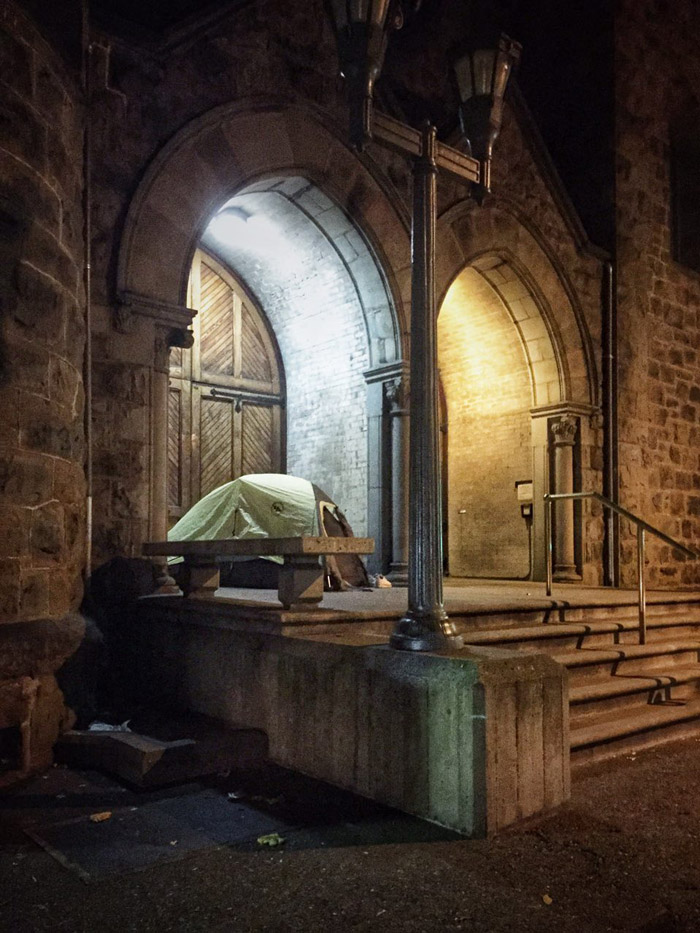 Homeless tent at the entrance to the building